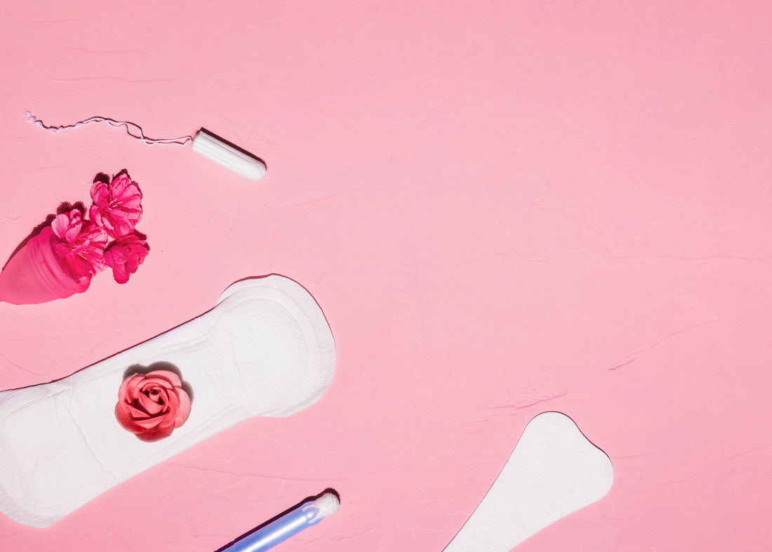 Feminine products alongside flowers